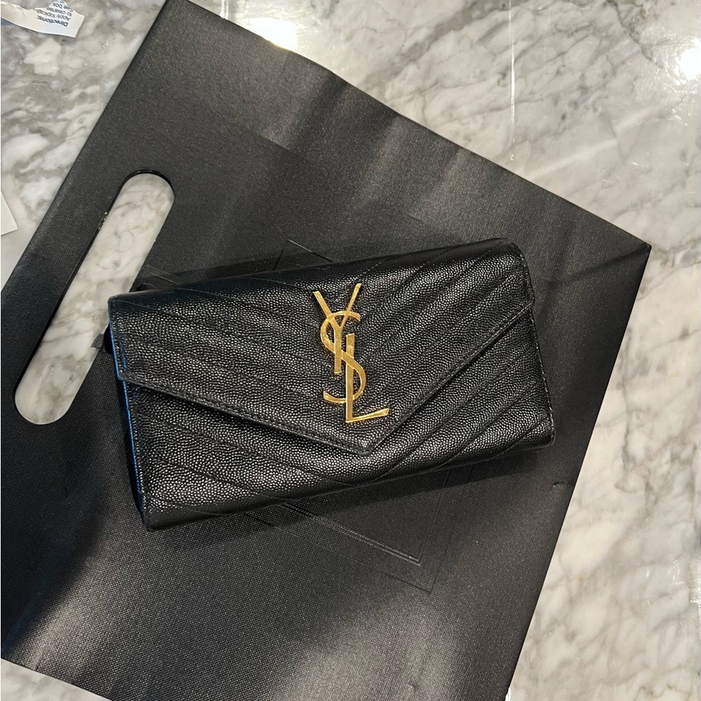CASSANDRE SAINT LAURENT MATELASSÉ LARGE FLAP WALLET